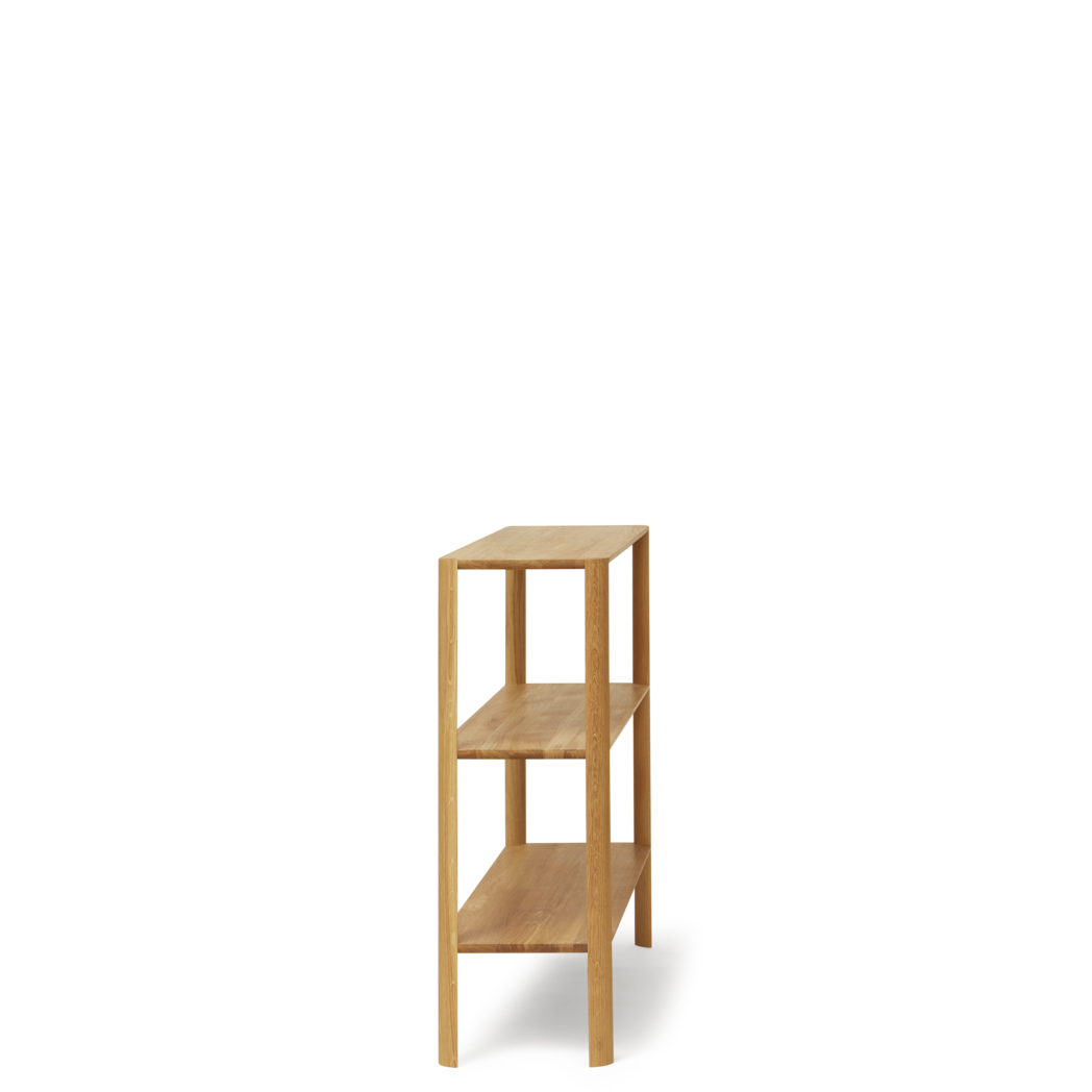 Møbel med 3 hylder set fra siden af 