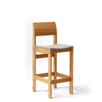 Barstol i eg med polstet sæde