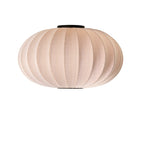 Rund loftlampe i sandfarvet med sorte detaljer